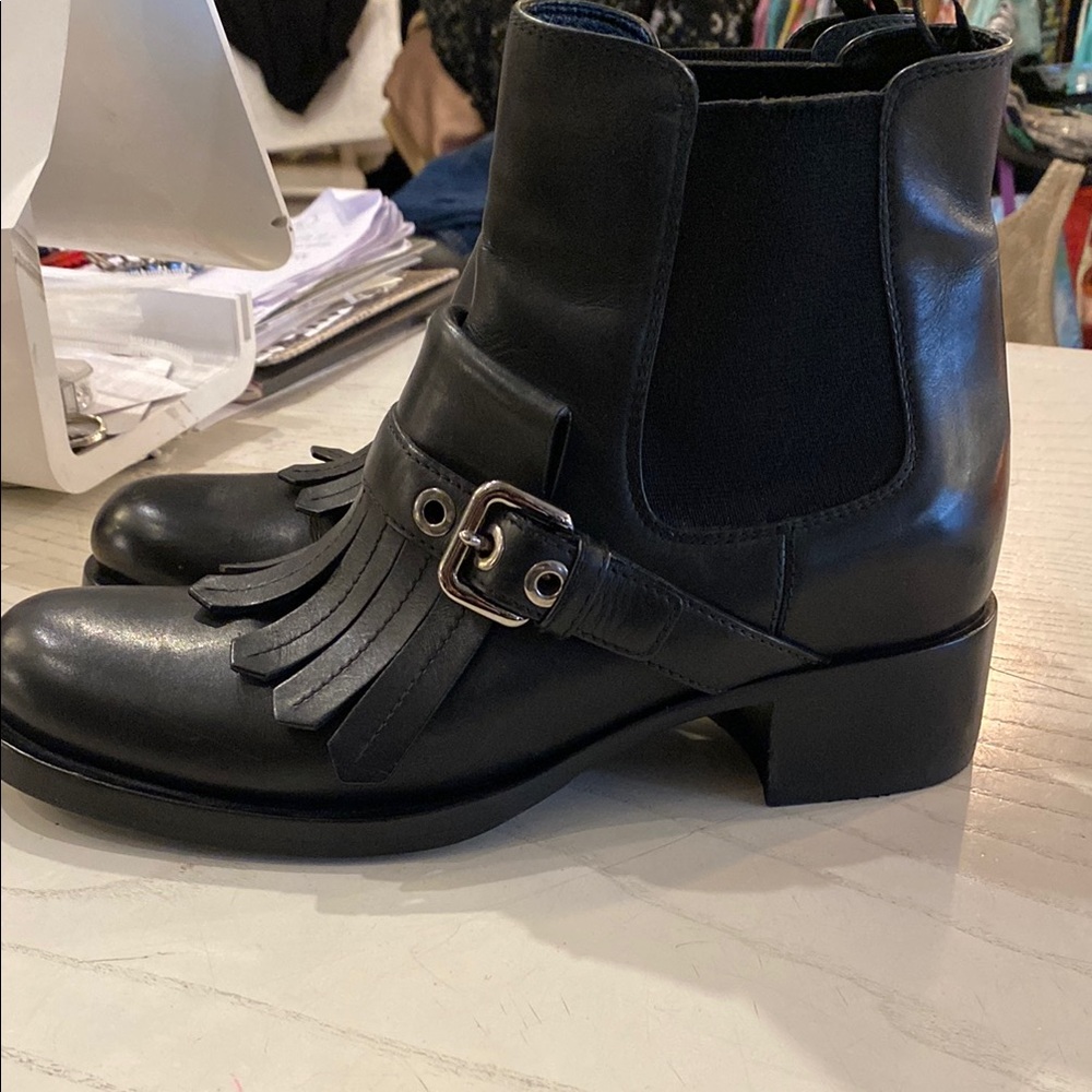 Prada kiltie black leather boots with buckle